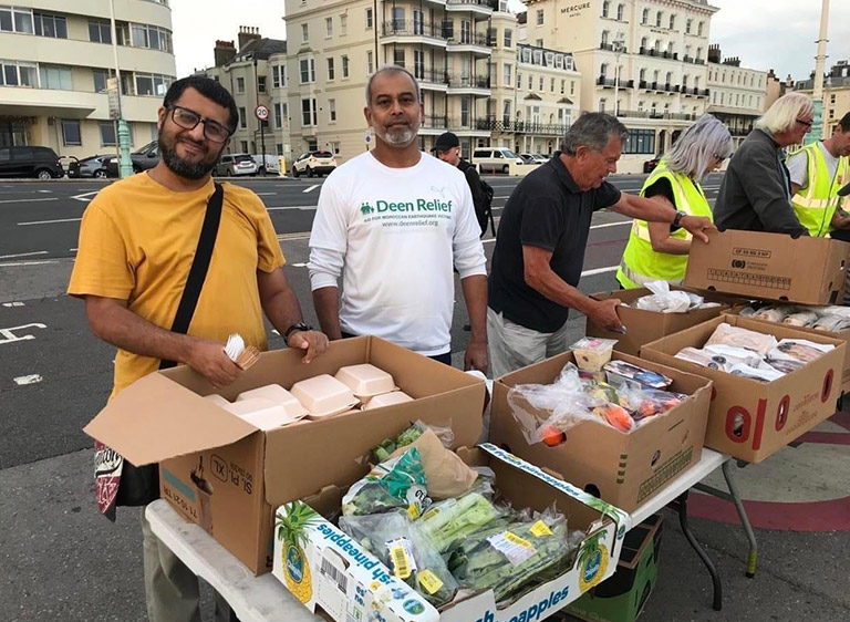 A group of volunteers with boxes of food