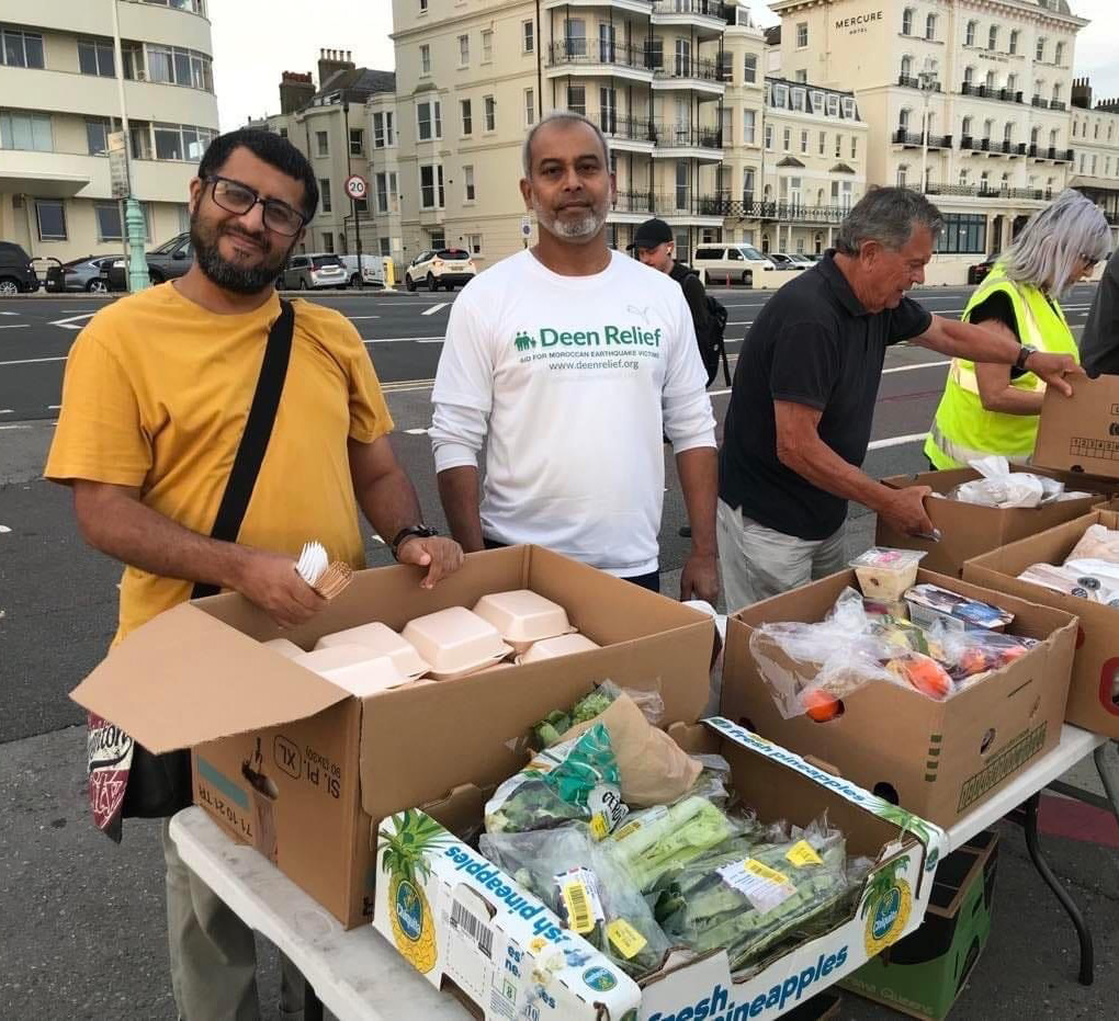 Volunteers with boxes of food